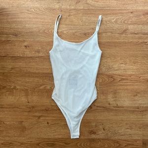 Honey Punch Fishnet Snap Closed Body Suit